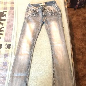 “No Boundaries”, blue boot cut jeans
